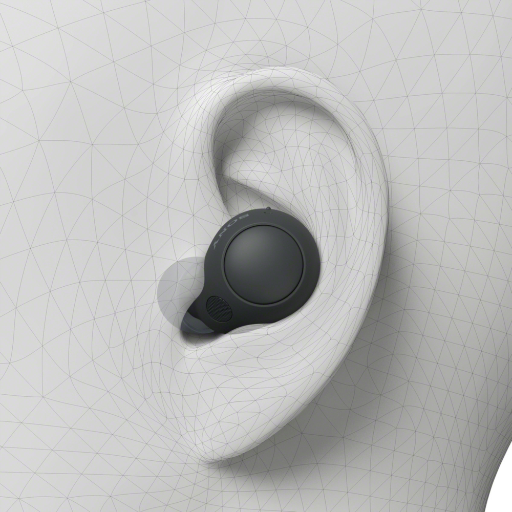 Écouteur dans l'oreille. Écouteur gris foncé dans une oreille blanche, effet filaire.