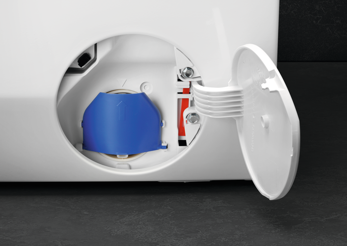 Nahaufnahme eines weißen Waschmaschinenfachs, Deckel geöffnet, blauer Innenraum sichtbar.