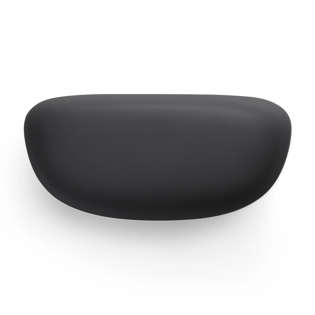 Schwarze, abgerundete Form, möglicherweise eine Soundbar, auf weißer Oberfläche, Draufsicht.