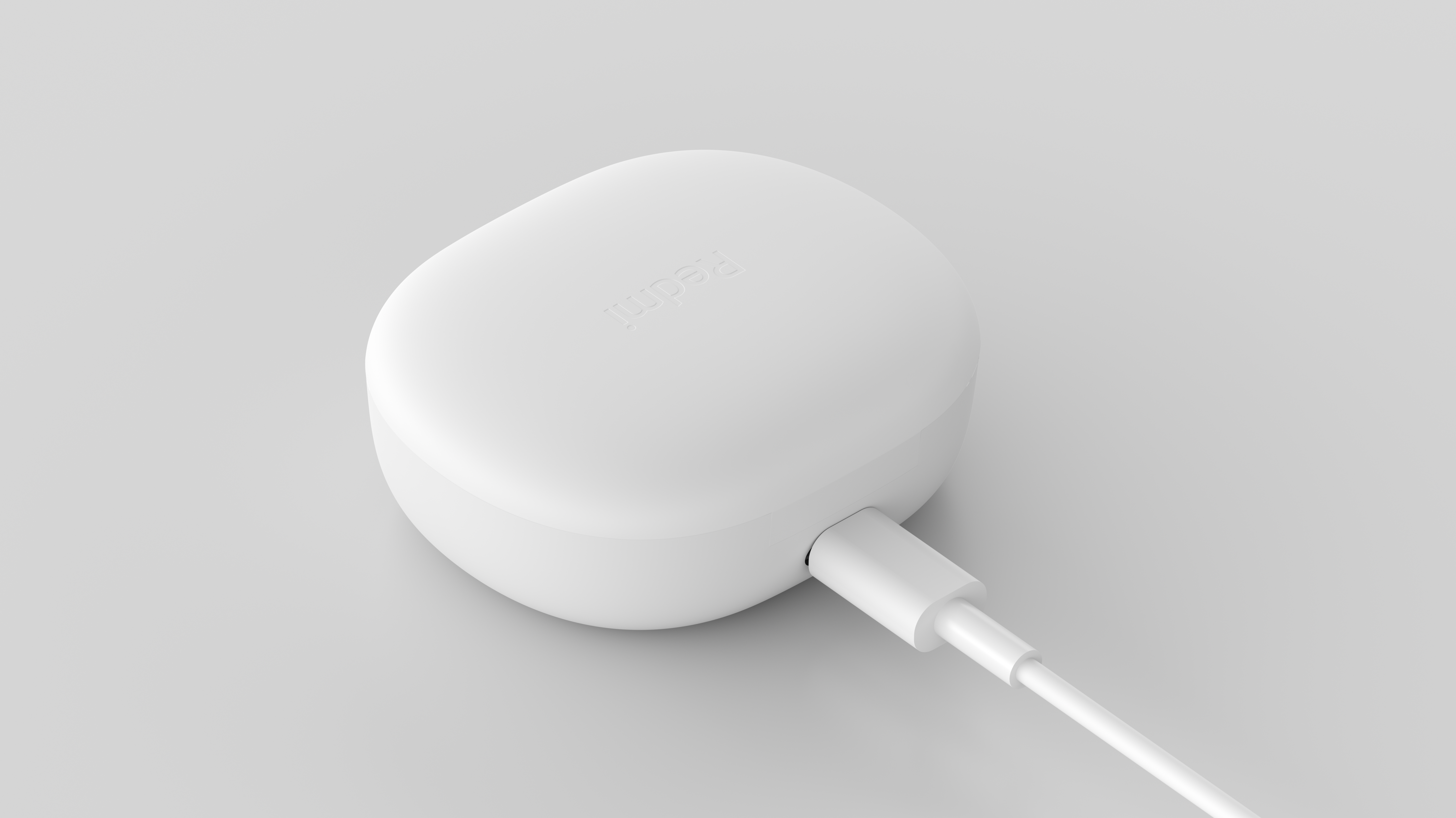 Fehér töltőtok USB-C kábellel. Szürke háttérben izolálva.
