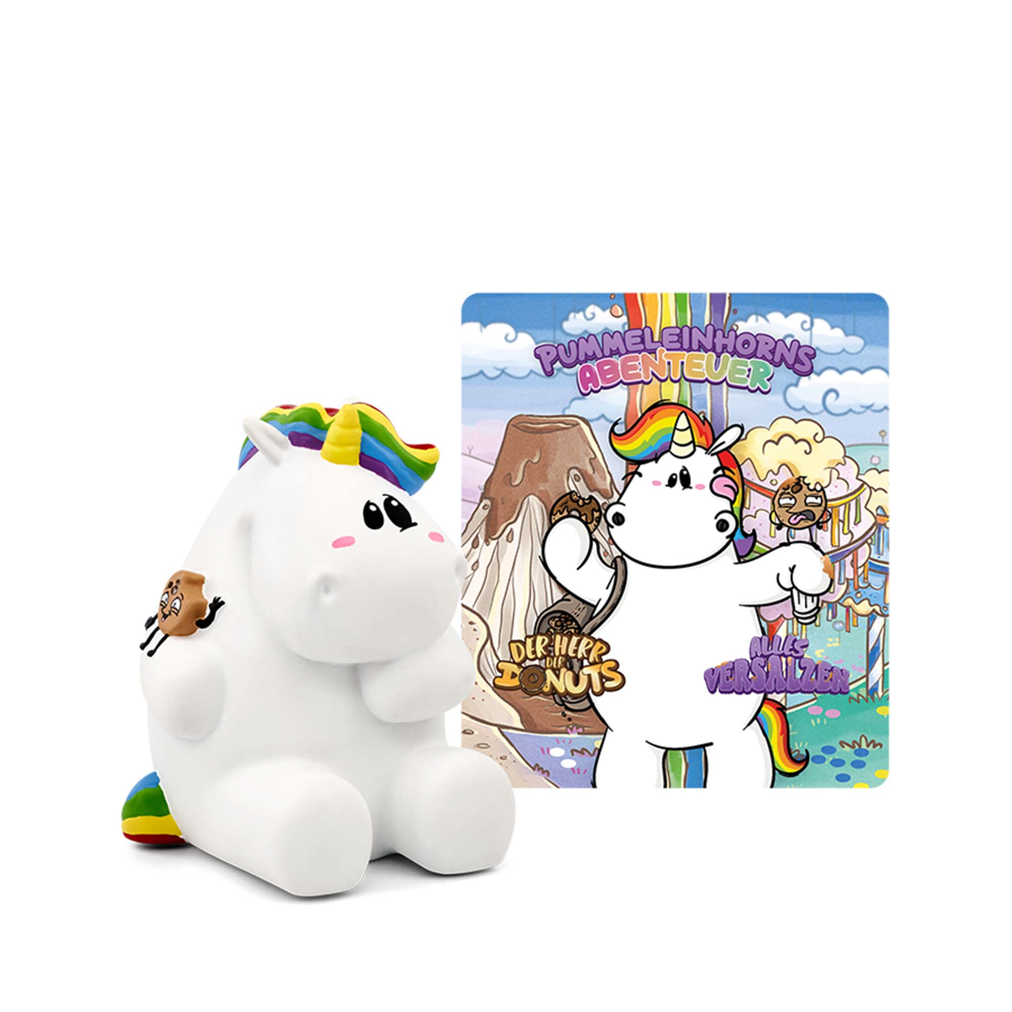 Weiße Einhornfigur mit Regenbogenmähne, sitzend mit einem Buchcover in der Nähe.