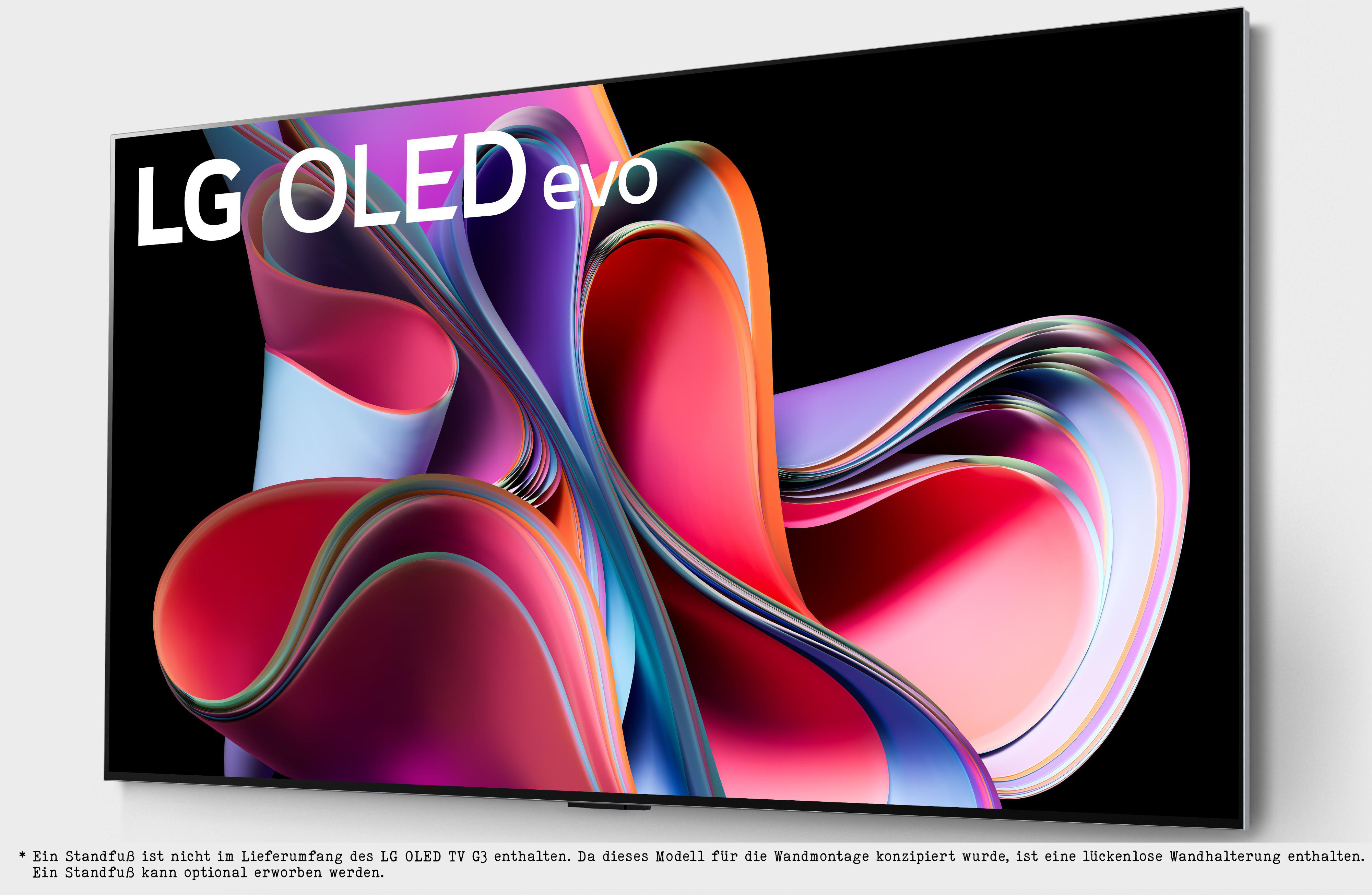 Ein LG OLED evo TV auf einer weißen Oberfläche. Es zeigt ein farbenfrohes abstraktes Design.
