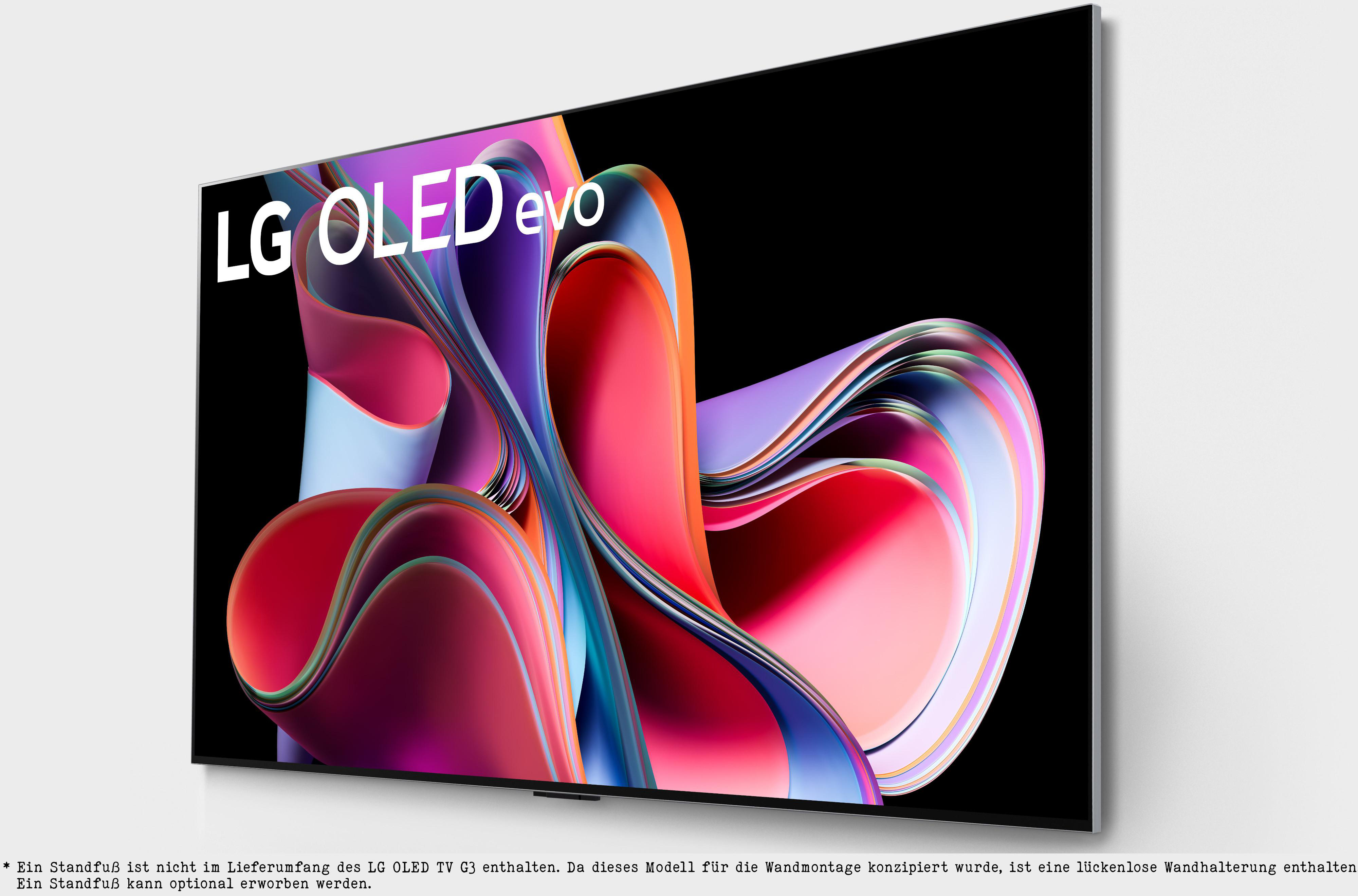 LG OLED evo Fernseher an einer weißen Wand. Der Bildschirm zeigt ein farbenfrohes abstraktes Design.