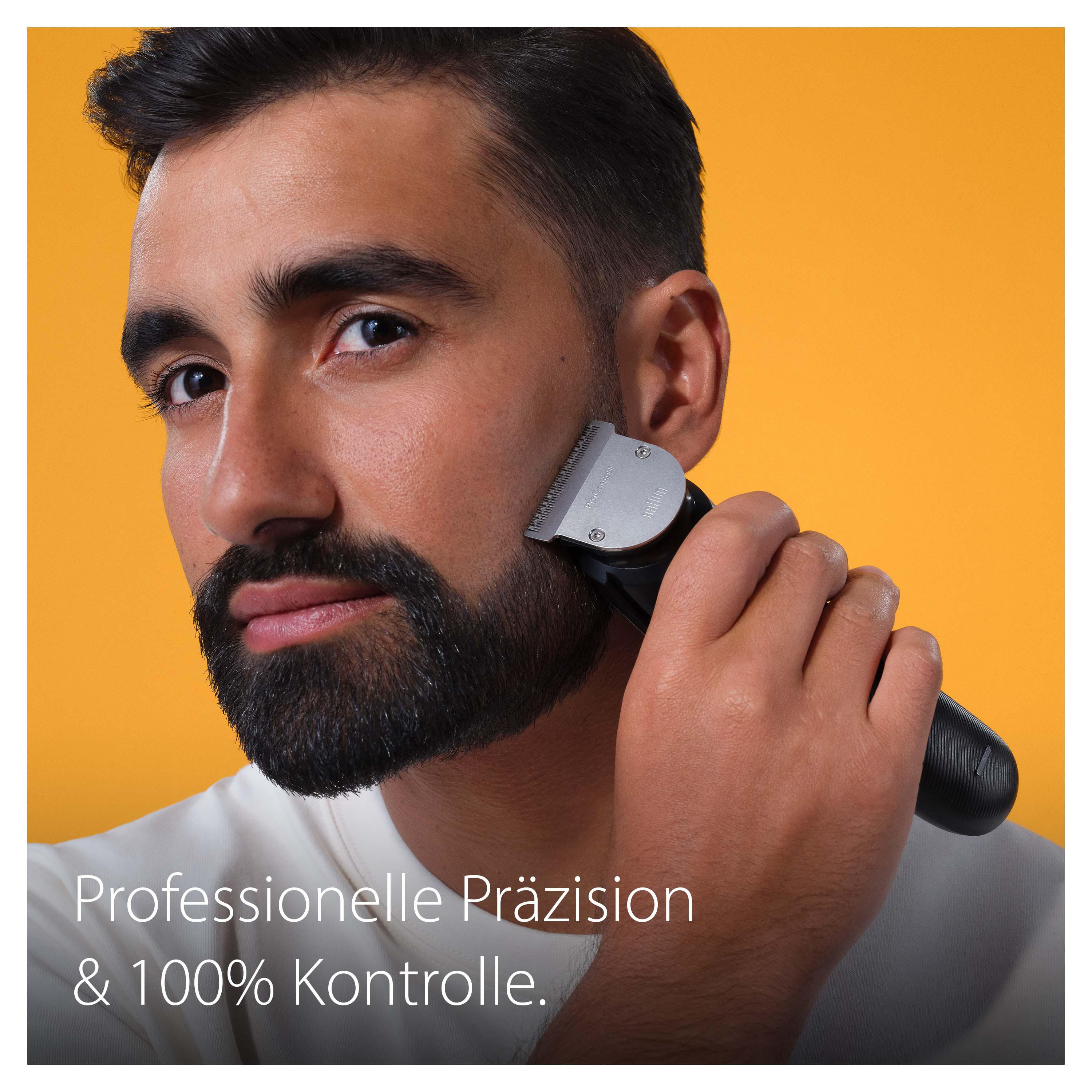 Mann rasiert Bart mit schwarzem Trimmer vor gelbem Hintergrund.
