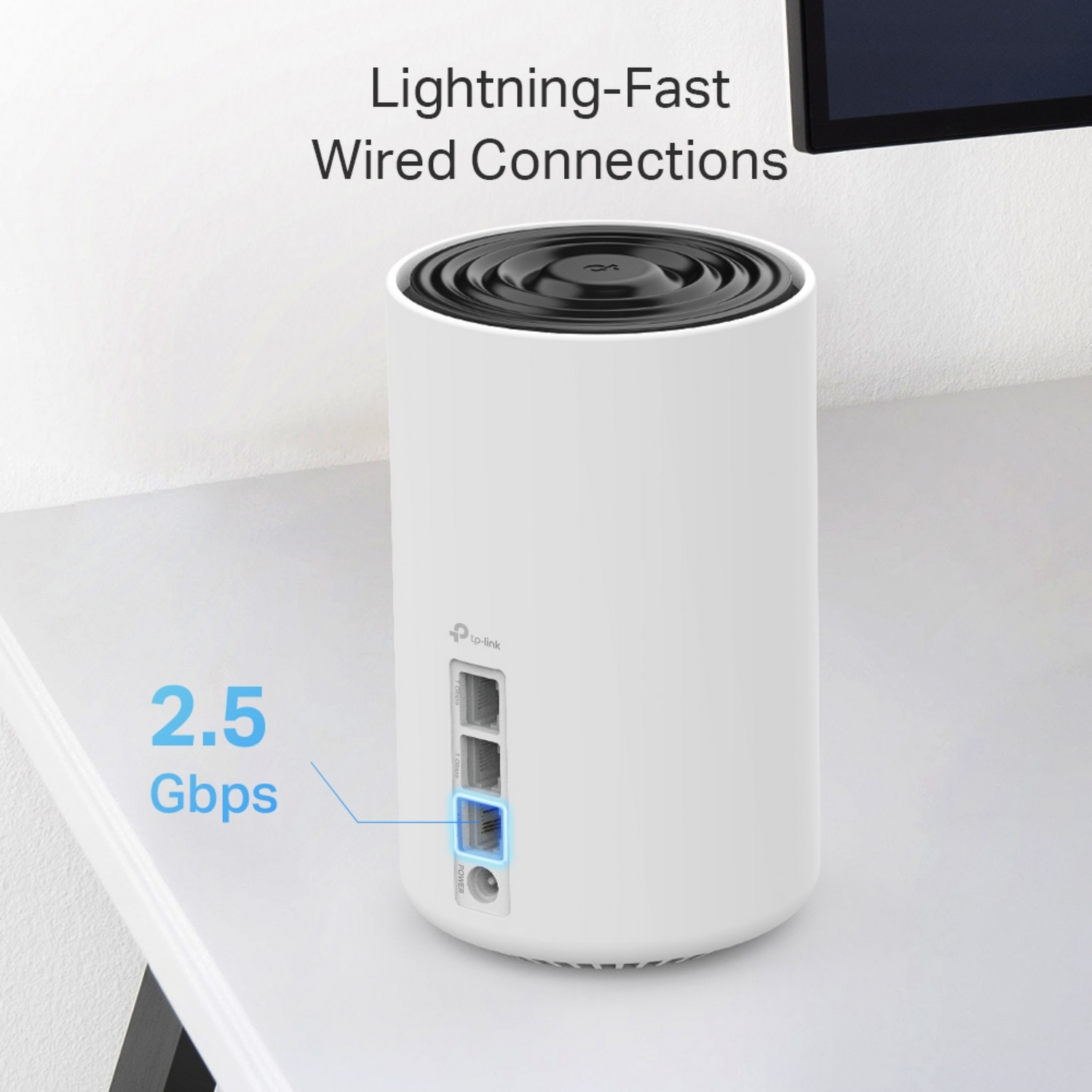 White TP-Link router on table with ports visible. White background.