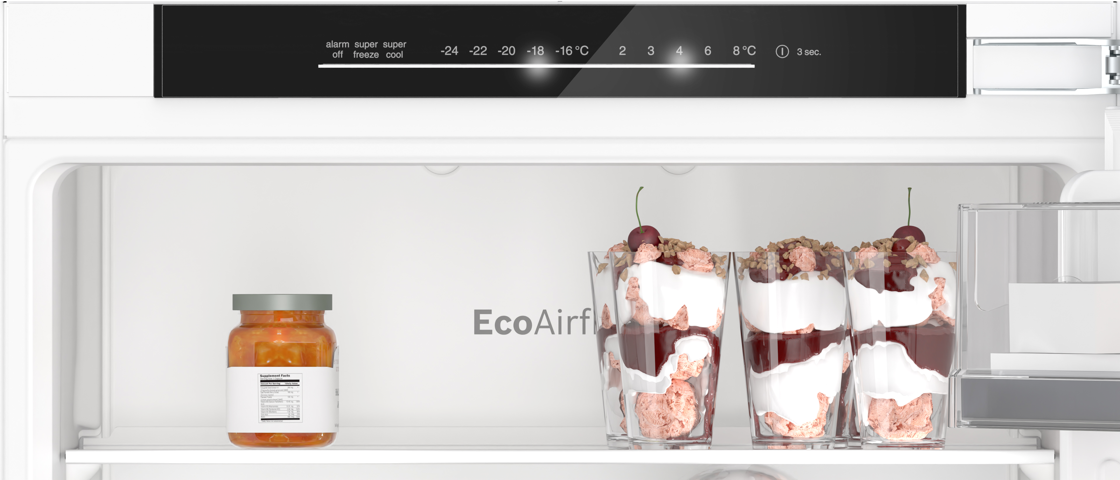 Inside a refrigerator: a jar and three desserts in glasses. Temperature settings are displayed above.