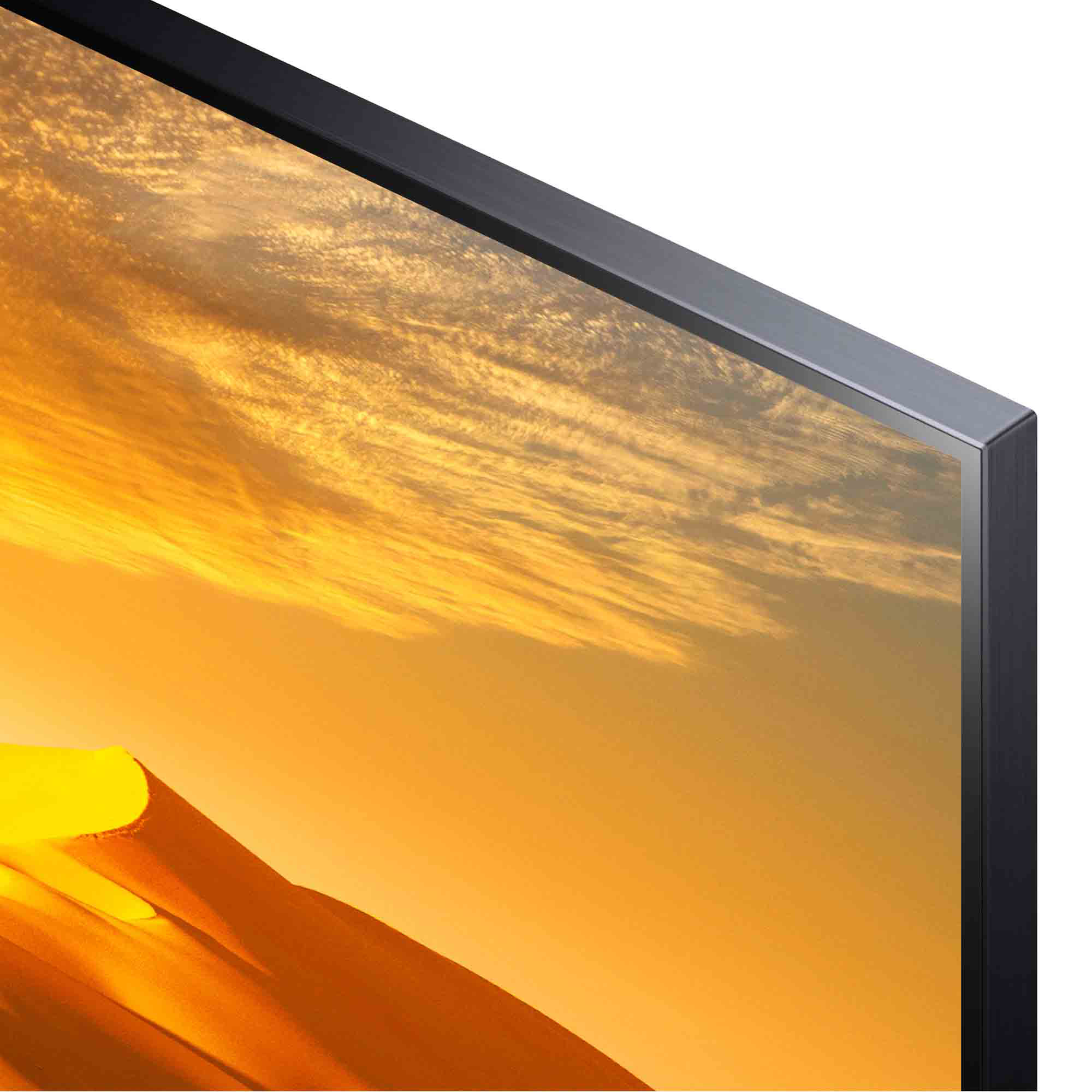 Primer plano de una pantalla de TV, mostrando un paisaje desértico dorado y un marco plateado.