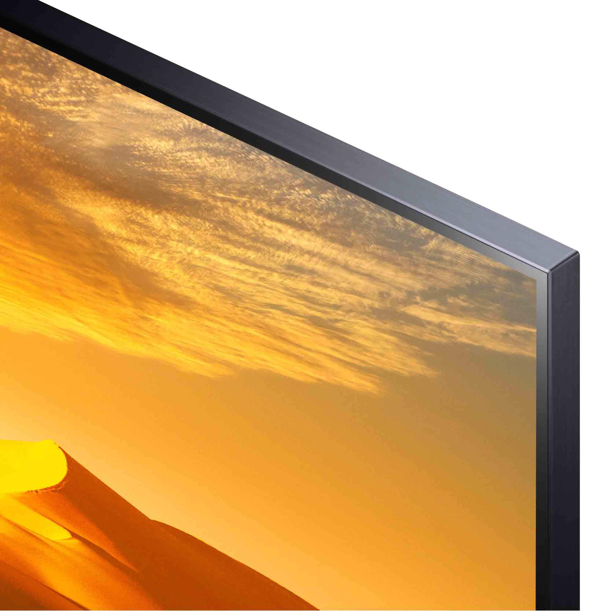 Primer plano de una esquina de TV con pantalla ancha, mostrando una escena de puesta de sol. Marco negro.