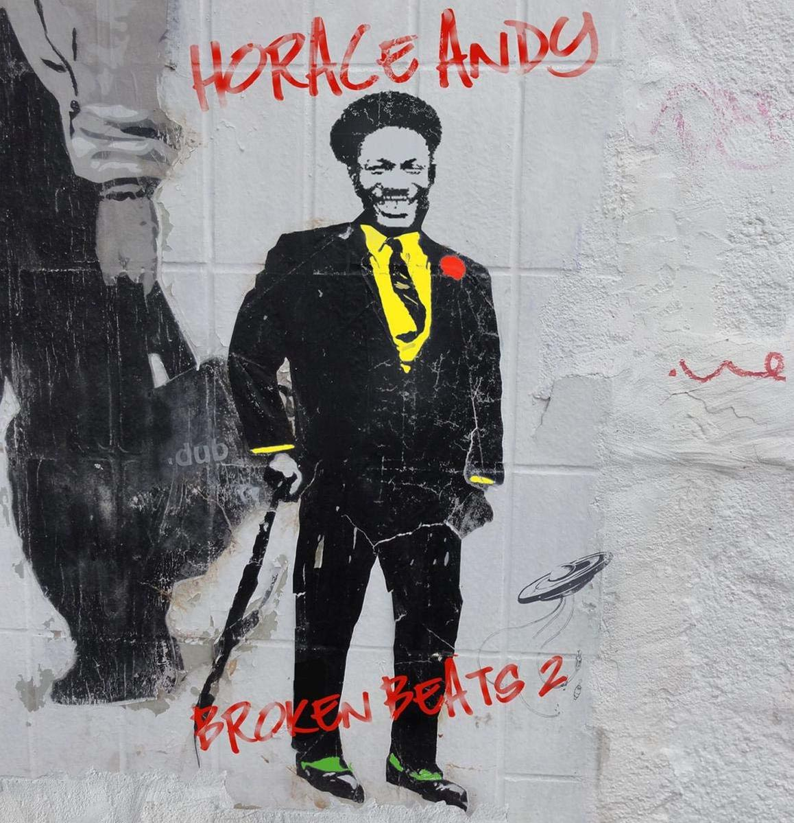 Ein Graffiti von Horace Andy. Er trägt einen Anzug und hält einen Gehstock. Text um ihn herum.