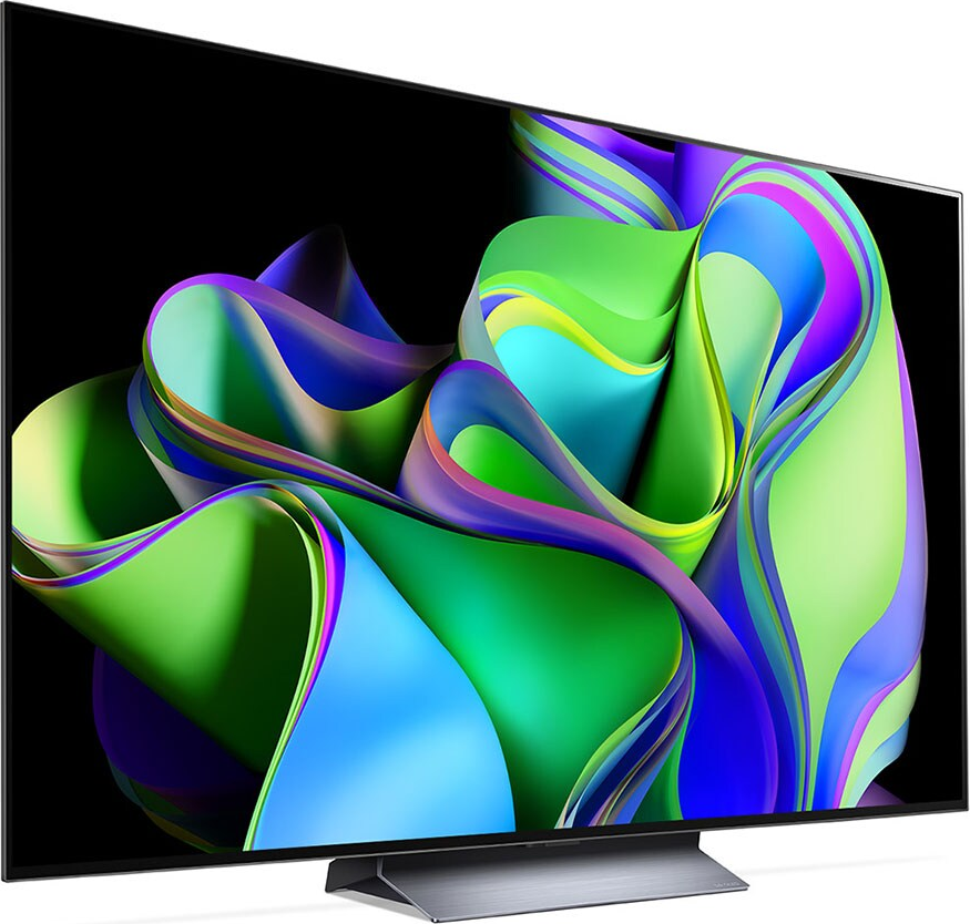 Ein moderner Fernseher mit einem lebendigen, abstrakten Design auf dem Bildschirm, auf einem silbernen Ständer.