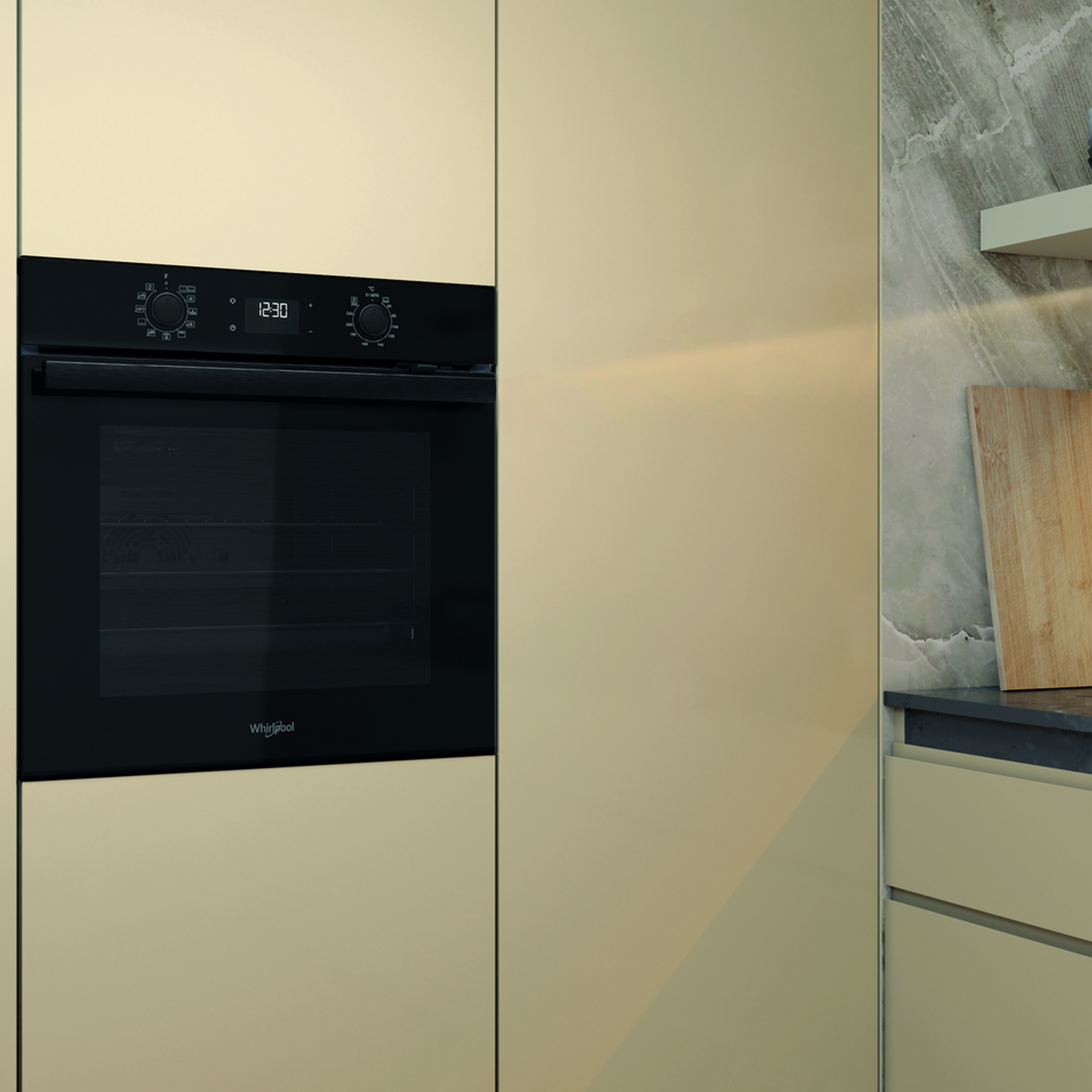 Built-in Whirlpool oven in a beige kitchen. Black oven door and control panel.