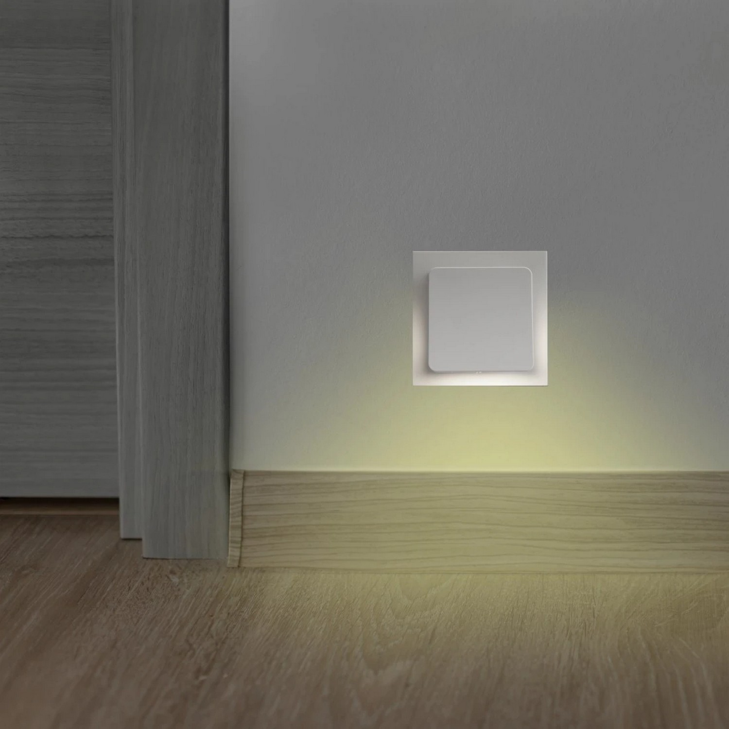 A wall-mounted light fixture emitting a soft glow.
