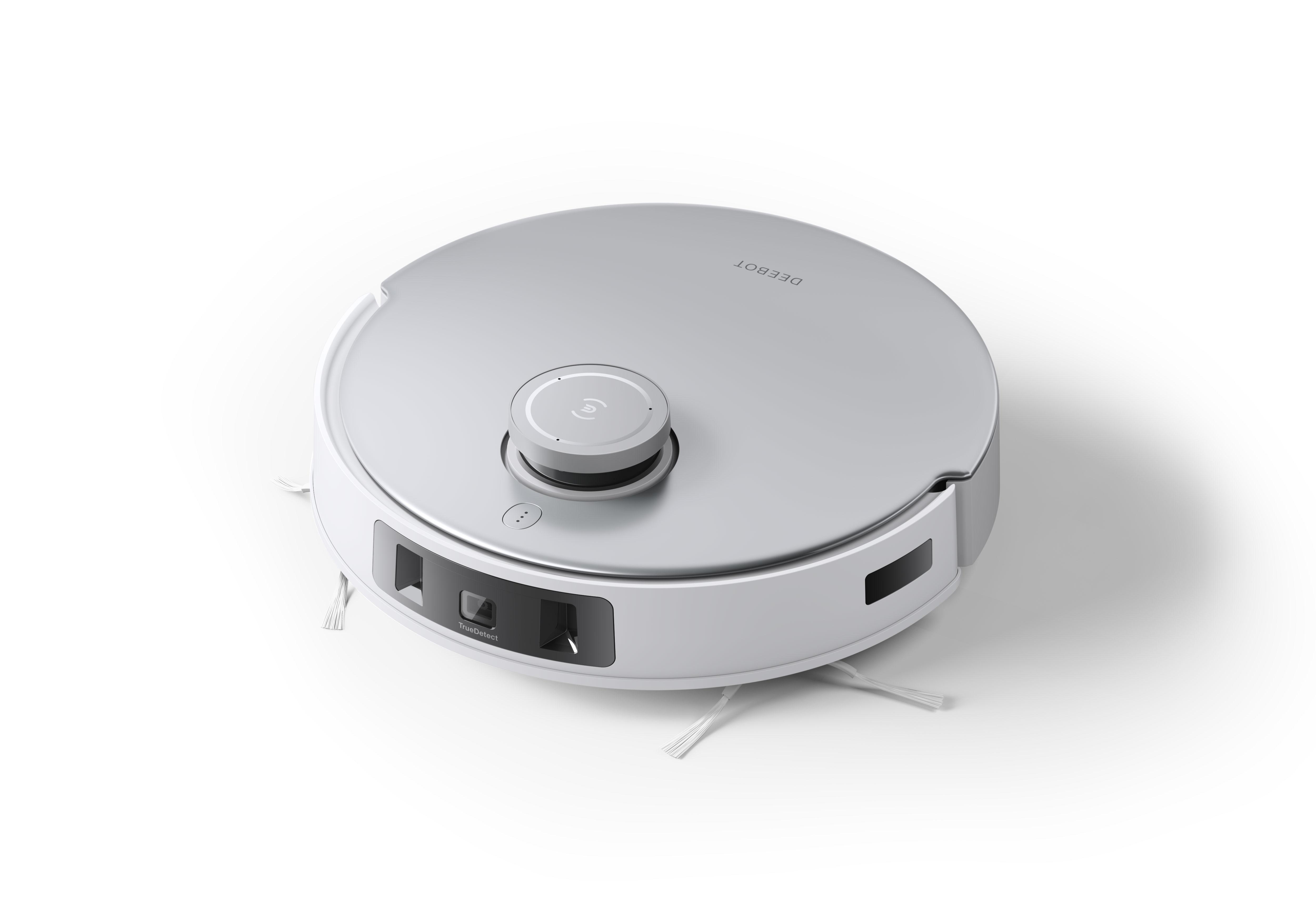 Roboter-Staubsauger. Silbernes Geh äuse, weiße Verkleidung. Runde Form, Bürsten, Taste.