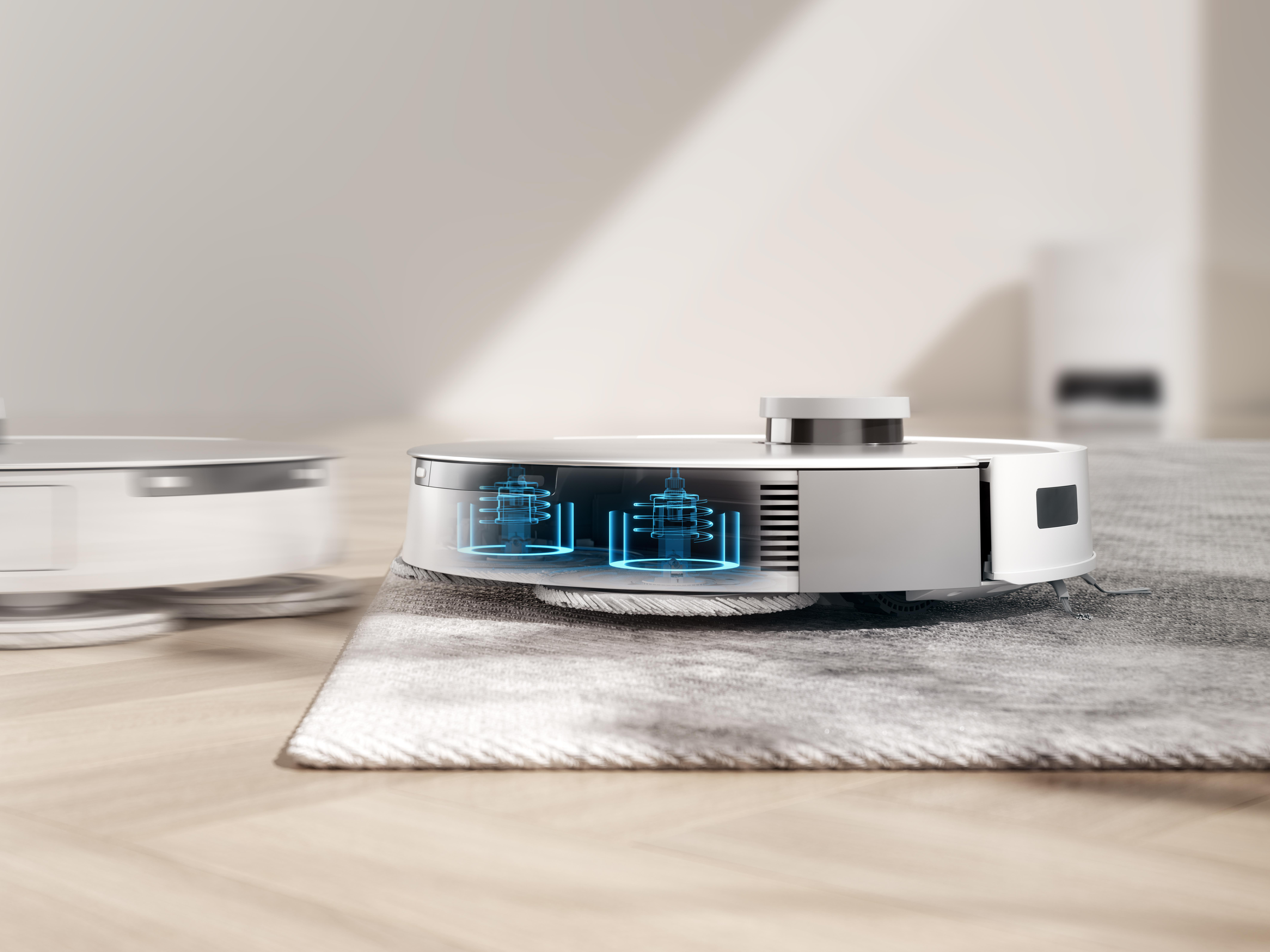 Roboter-Staubsauger auf Teppich, unscharfer Hintergrund.