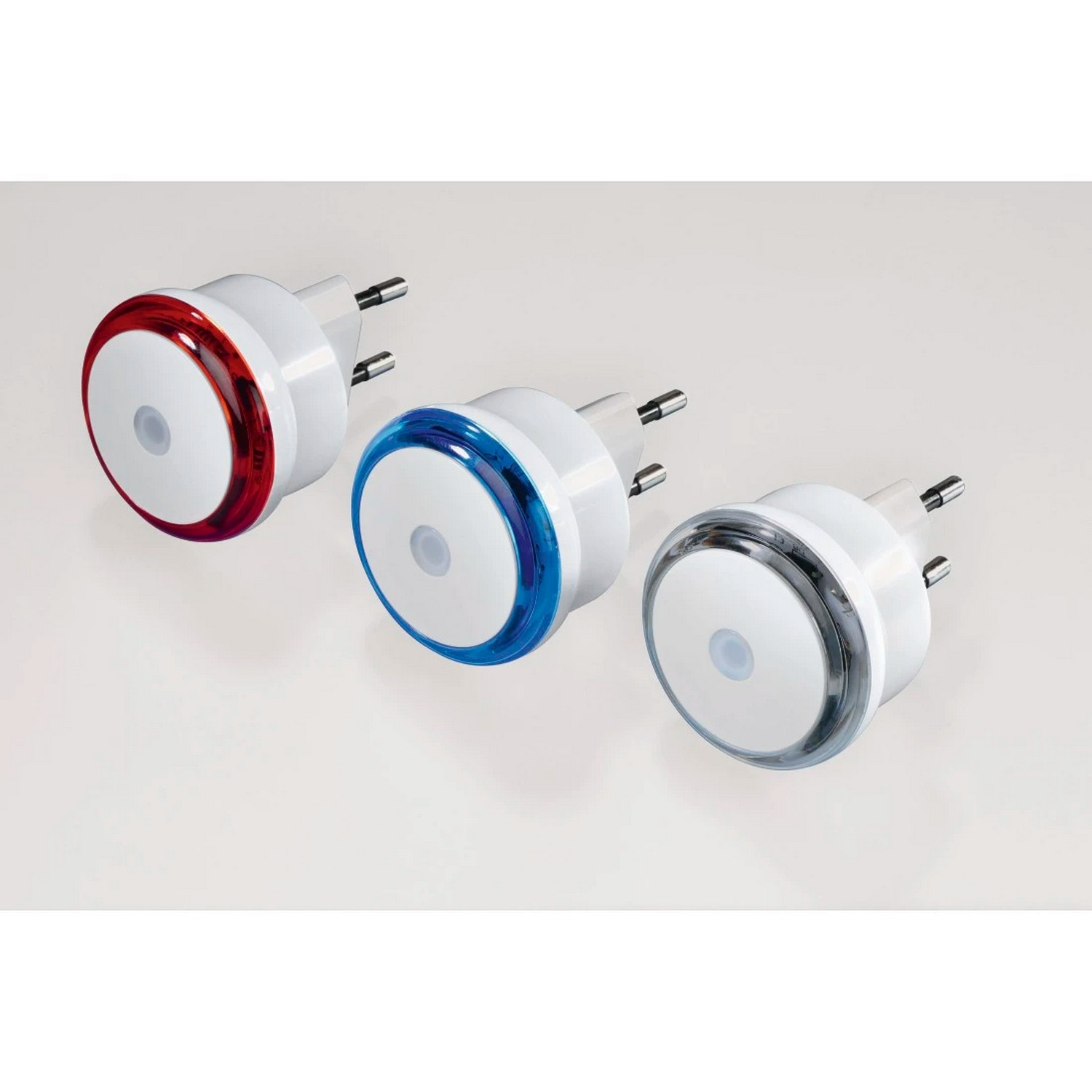 Three white plug-in nightlights with red, blue, and clear lights.