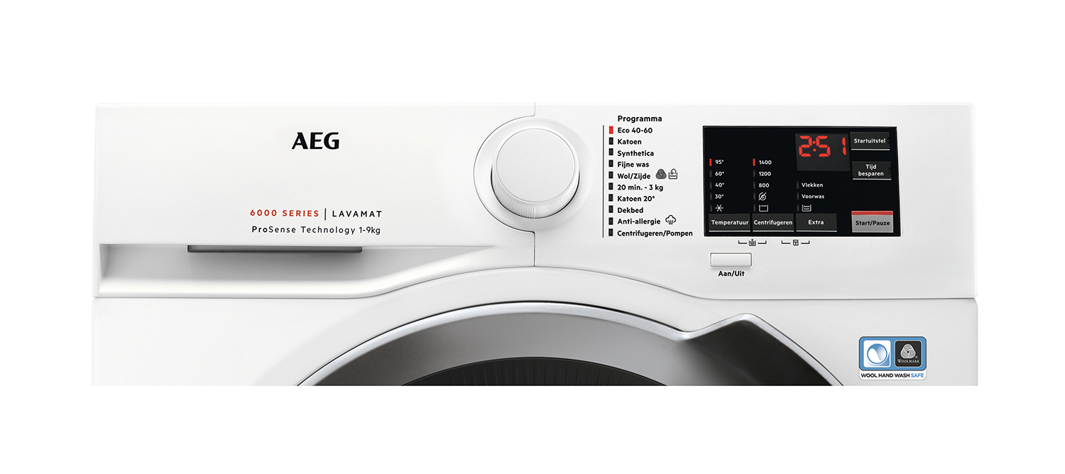 White washing machine with controls and a digital display.
