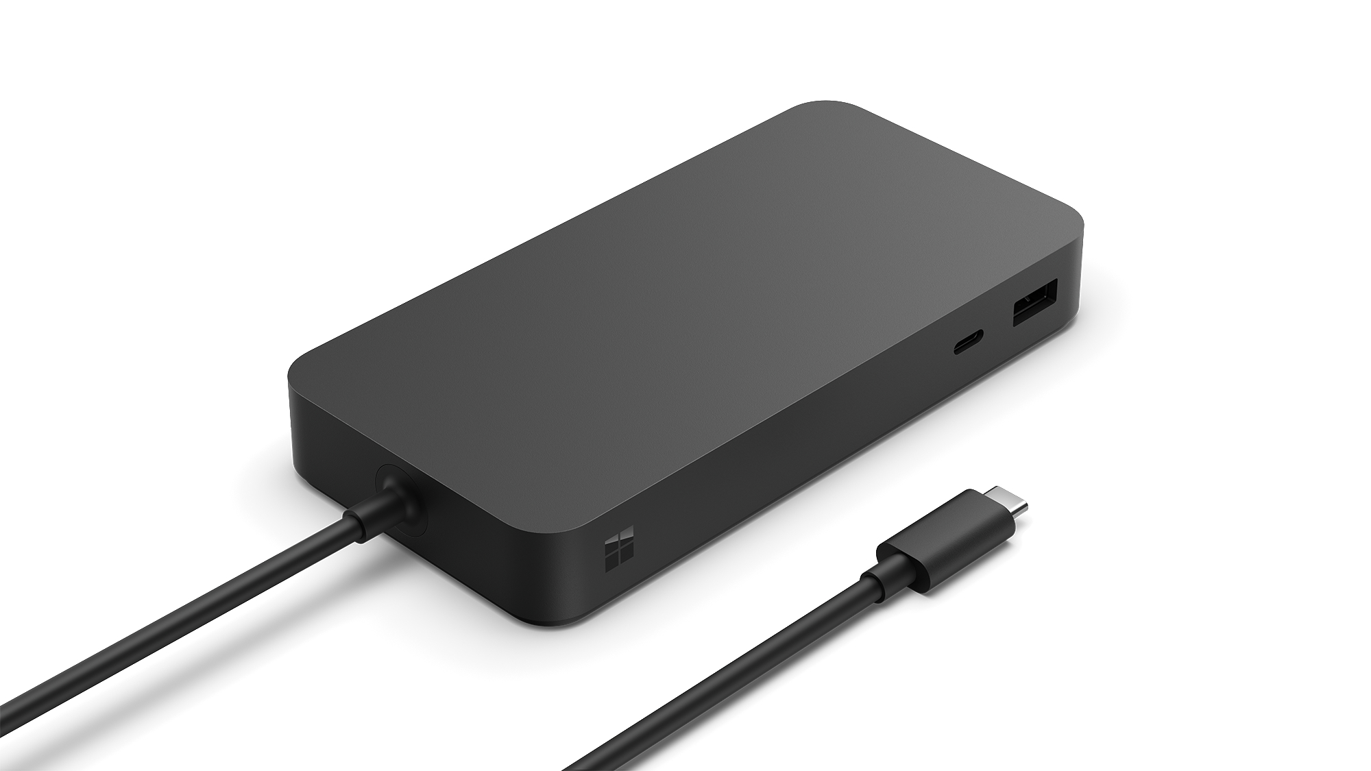 Schwarzes, rechteckiges Surface Dock mit angeschlossenem schwarzen Kabel und USB-C-Anschluss.