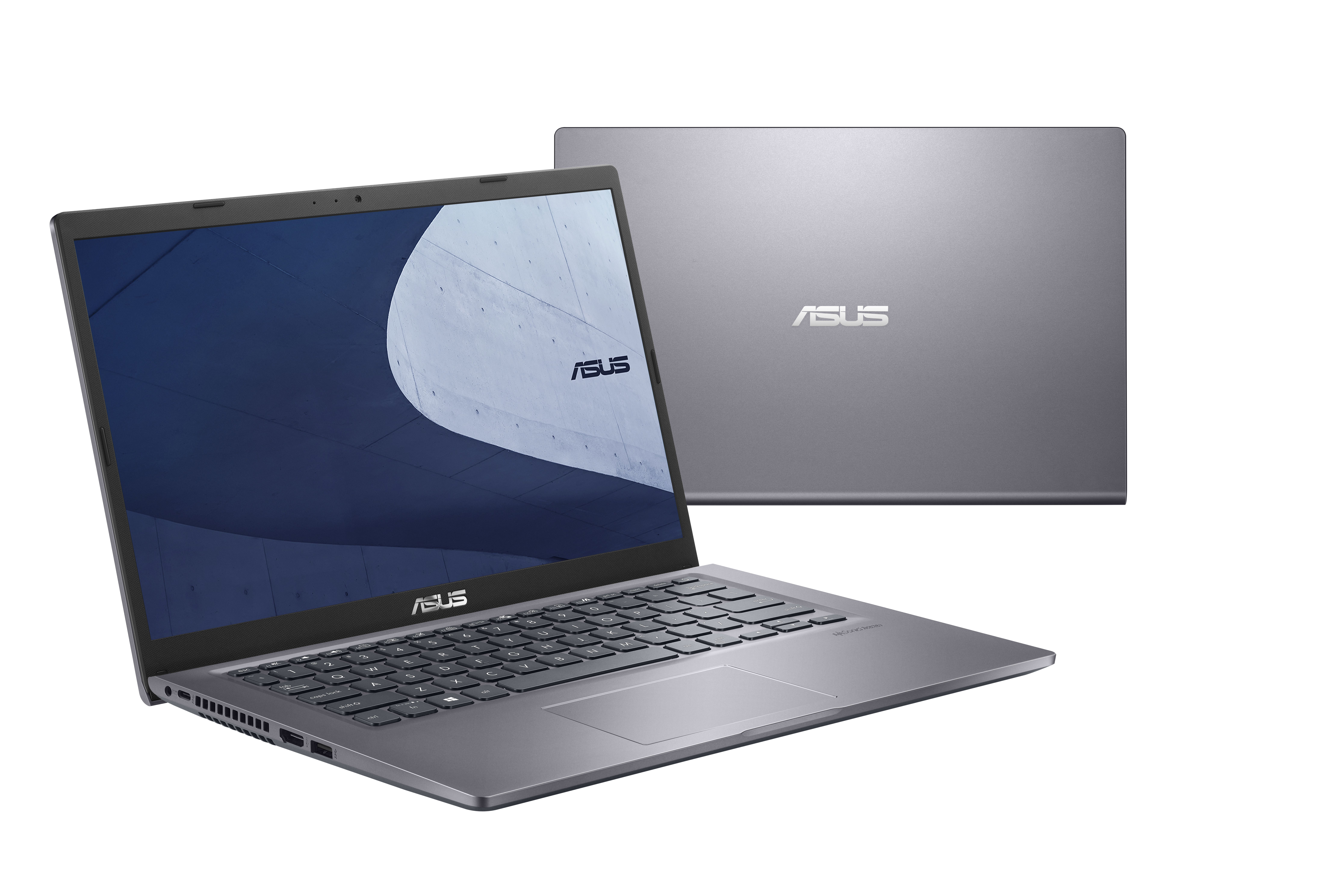 Un portátil ASUS gris. La tapa está abierta, mostrando la pantalla y el teclado. Otro portátil detrás.