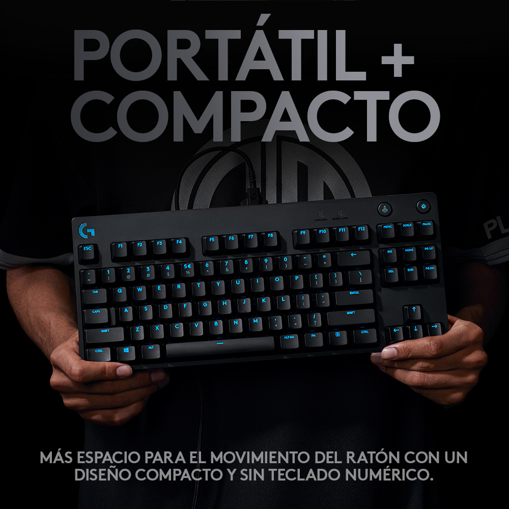 Un teclado negro es sostenido por manos, con texto encima que dice 'PORTÁTIL + COMPACTO' en español.