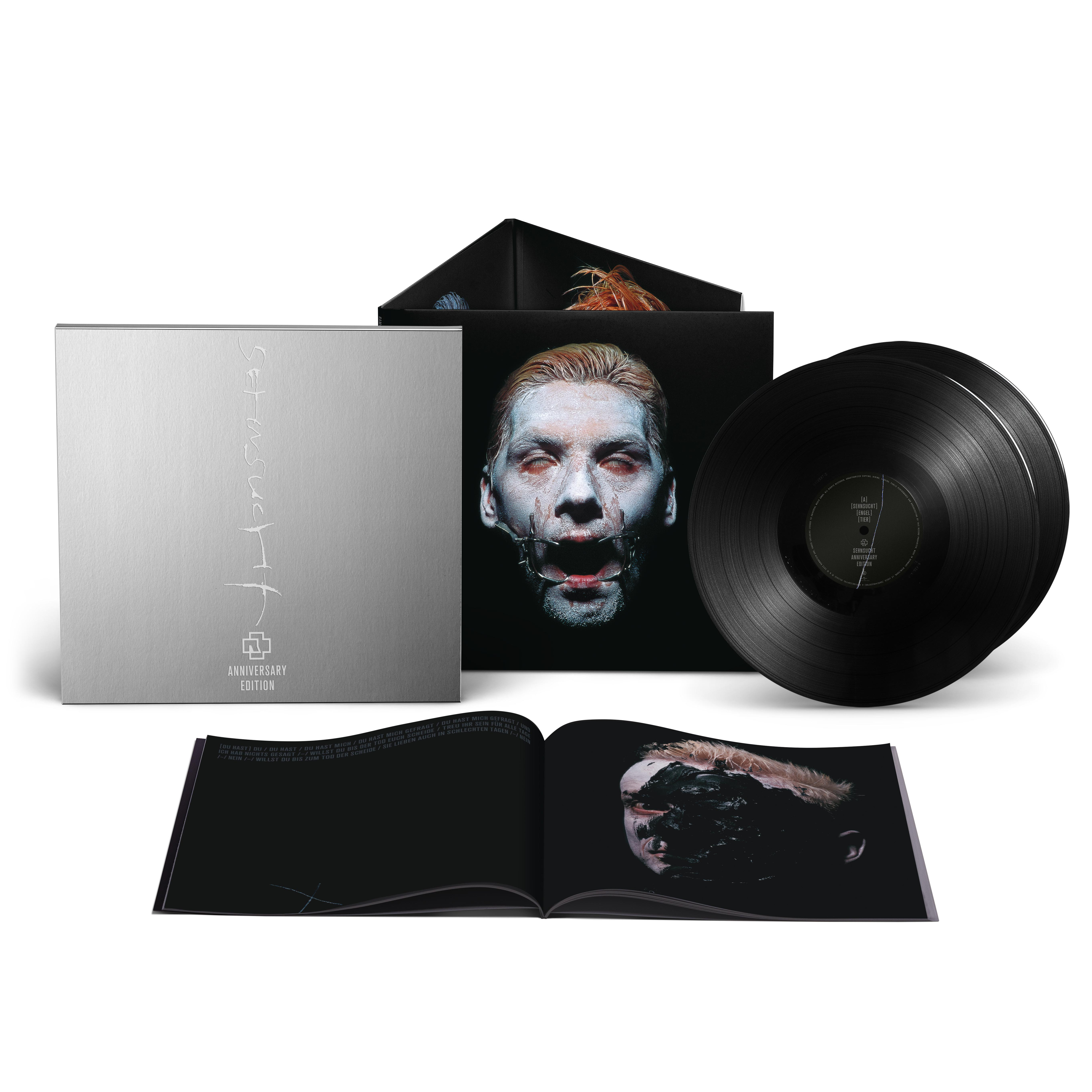 Album-Set mit Vinyl-Schallplatten, Hülle mit Gesicht und offenem Booklet.