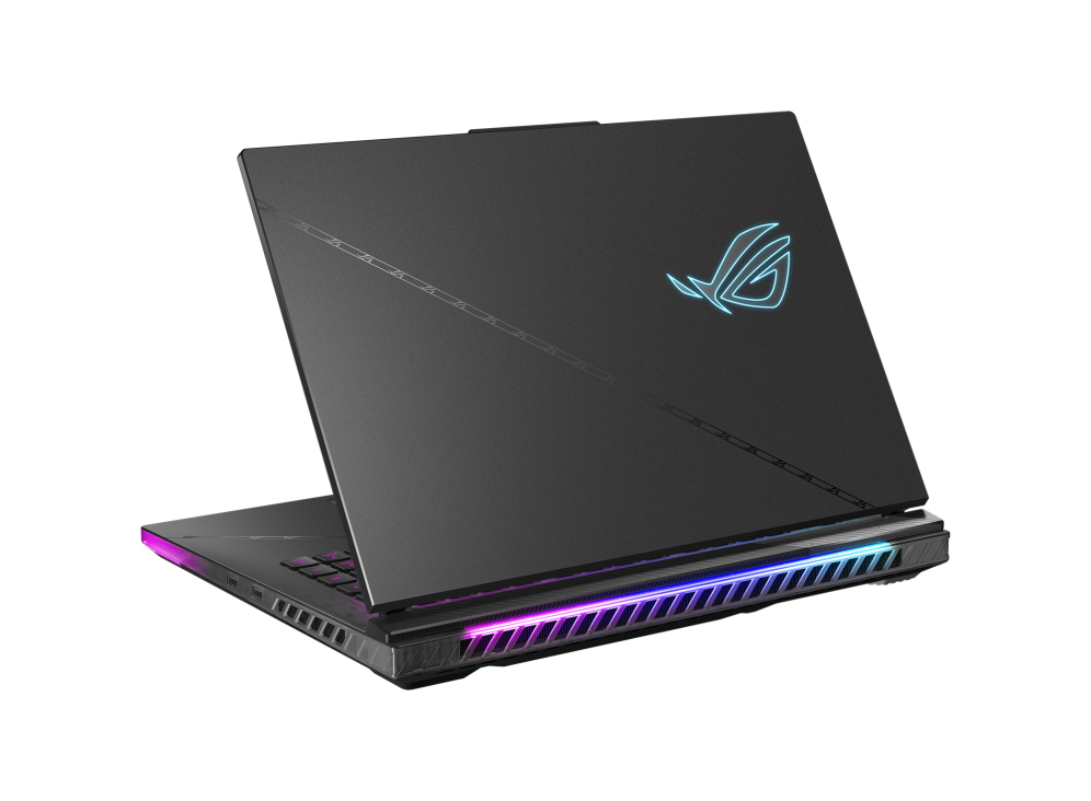 Un portátil negro con un logotipo ROG brillante y luces coloridas en la parte inferior.