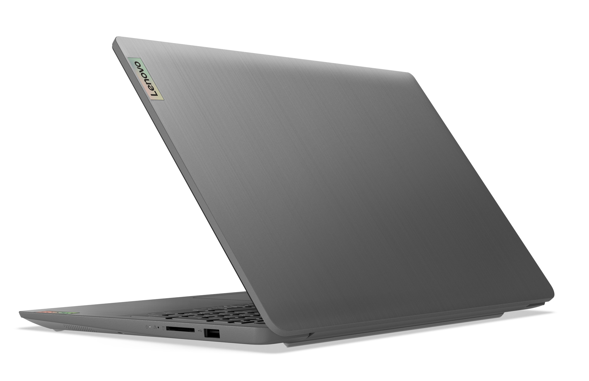 Portátil Lenovo gris abierto sobre una superficie blanca. Pantalla en ángulo, mostrando el teclado.