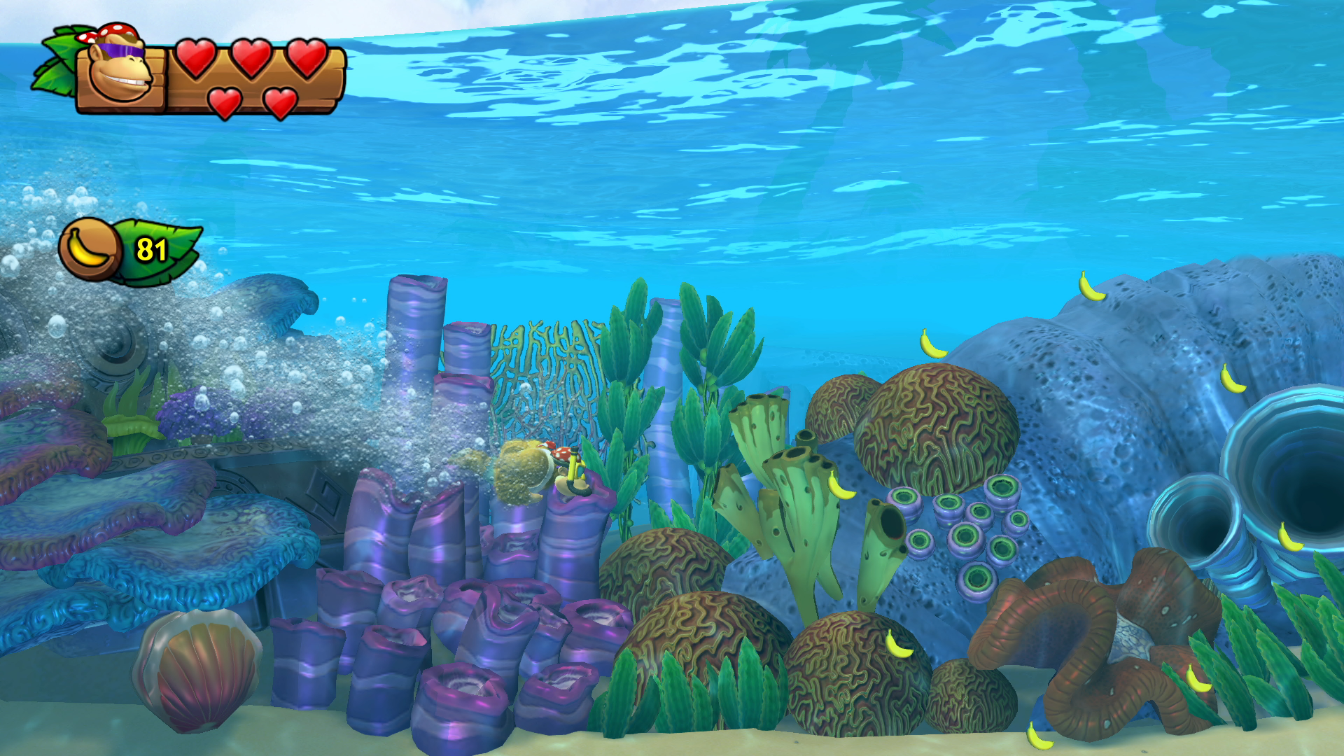 Underwater scene with a Donkey Kong character, coral, and bubbles.