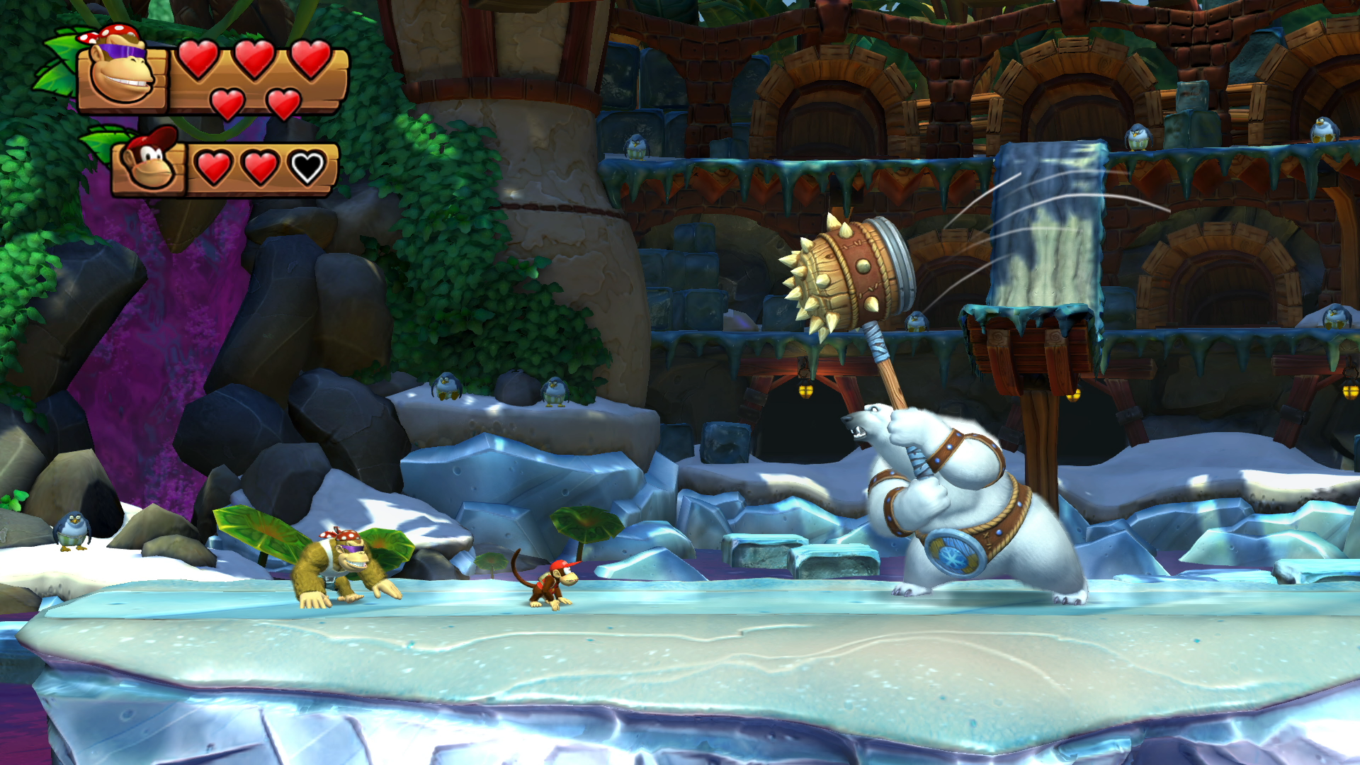 A video game scene with characters on ice, fighting, and a background.