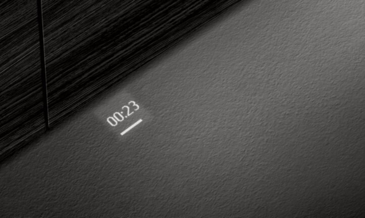 Ciemna powierzchnia z wyświetlaczem timera. Timer pokazuje 00:23 z poziomą linią pod liczbami.
