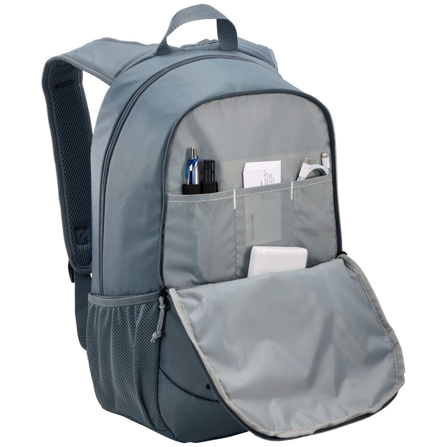 A blue backpack with several items in an open pocket.