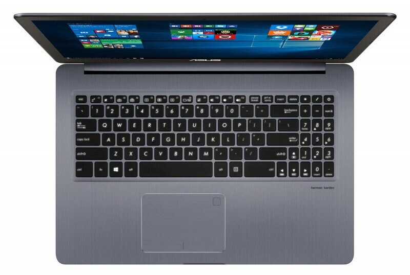 Otwarty laptop wyświetla pulpit systemu Windows z aplikacjami i logo LG.