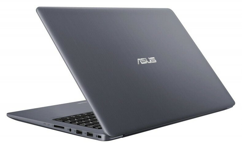 Ciemnoszary laptop na białej powierzchni, lekko pochylony.