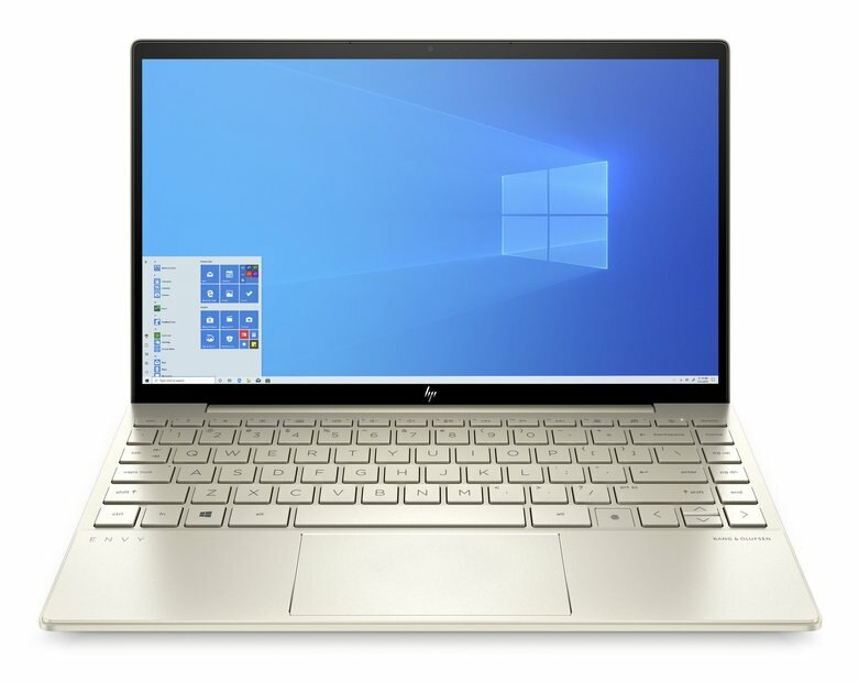 Złoty laptop z ekranem Windows. Widoczna klawiatura. Białe tło.