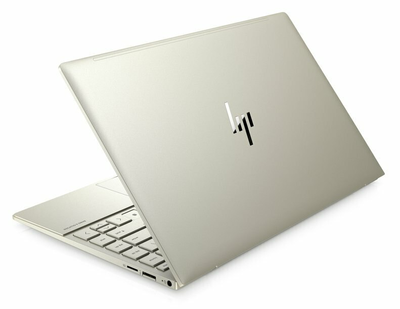 Beżowy laptop na białej powierzchni. Pokrywa otwarta, widoczna klawiatura.