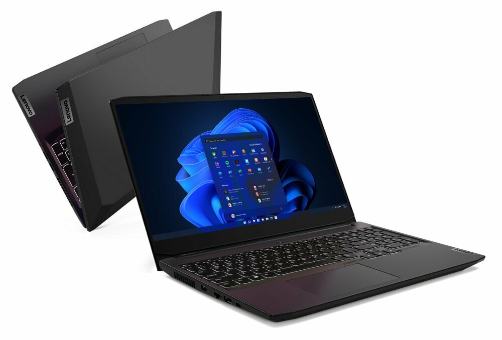 Czarny laptop otwarty z ekranem Windows i drugi laptop z tyłu.