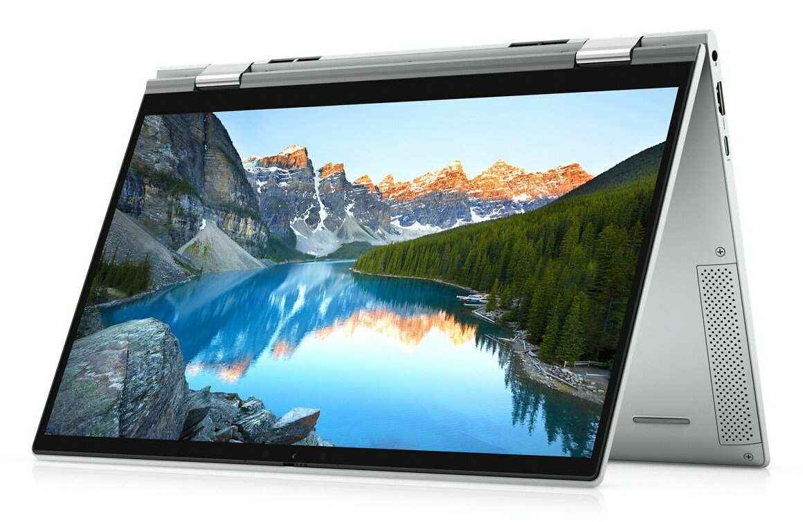 Laptop pokazuje jezioro z górami w tle. Ekran jest pochylony. Srebrna ramka i obudowa.