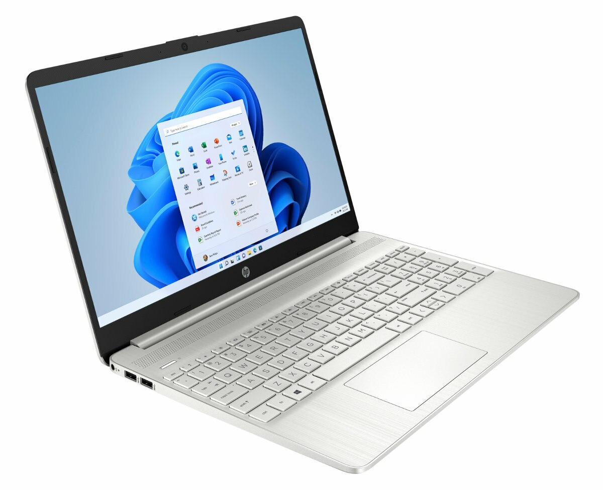 Srebrny laptop na białej powierzchni, pokazujący Windows 11.