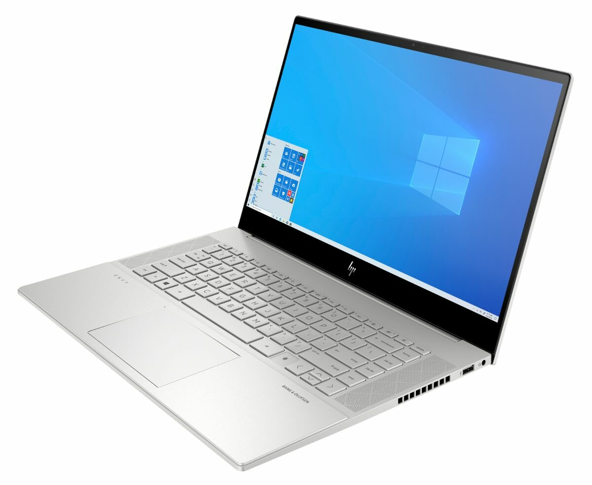 Srebrny laptop otwarty, z interfejsem Windows. Beżowa klawiatura i touchpad.