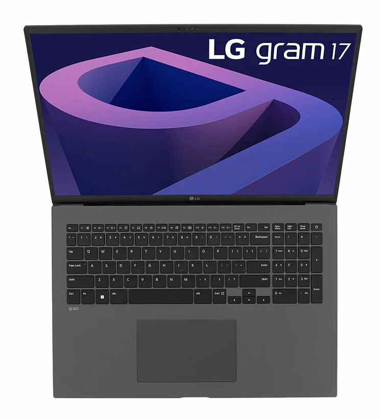 Otwarty srebrny laptop z logo LG na górze, widoczną klawiaturą i ciemnym ekranem.