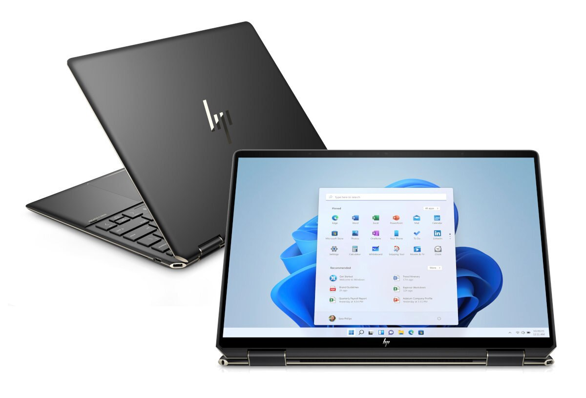 Czarny laptop HP, otwarty, aby pokazać interfejs Windows 11. Inny laptop w tle.