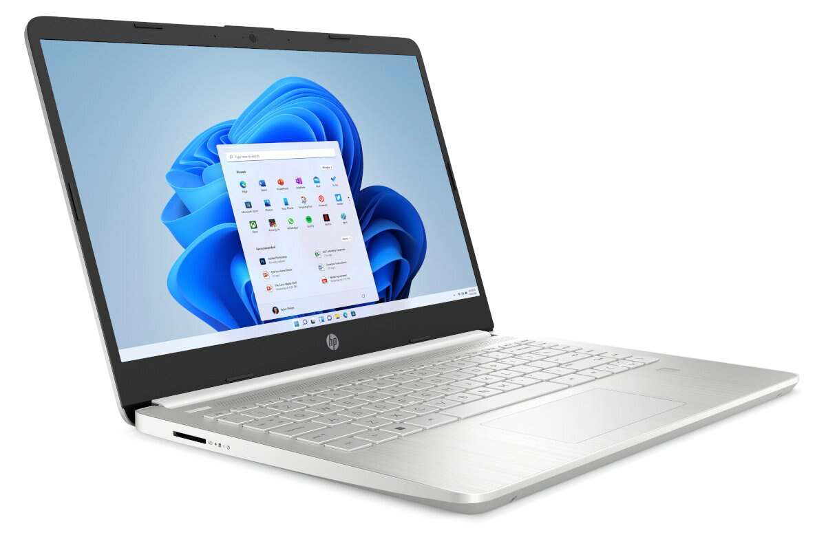 Srebrny laptop z menu Windows 11. Laptop jest na białej powierzchni.