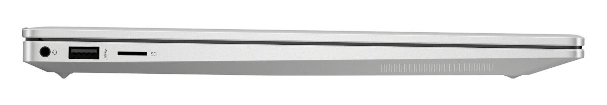 Srebrny laptop z boku, zamknięty. Porty widoczne po lewej stronie. Białe tło.