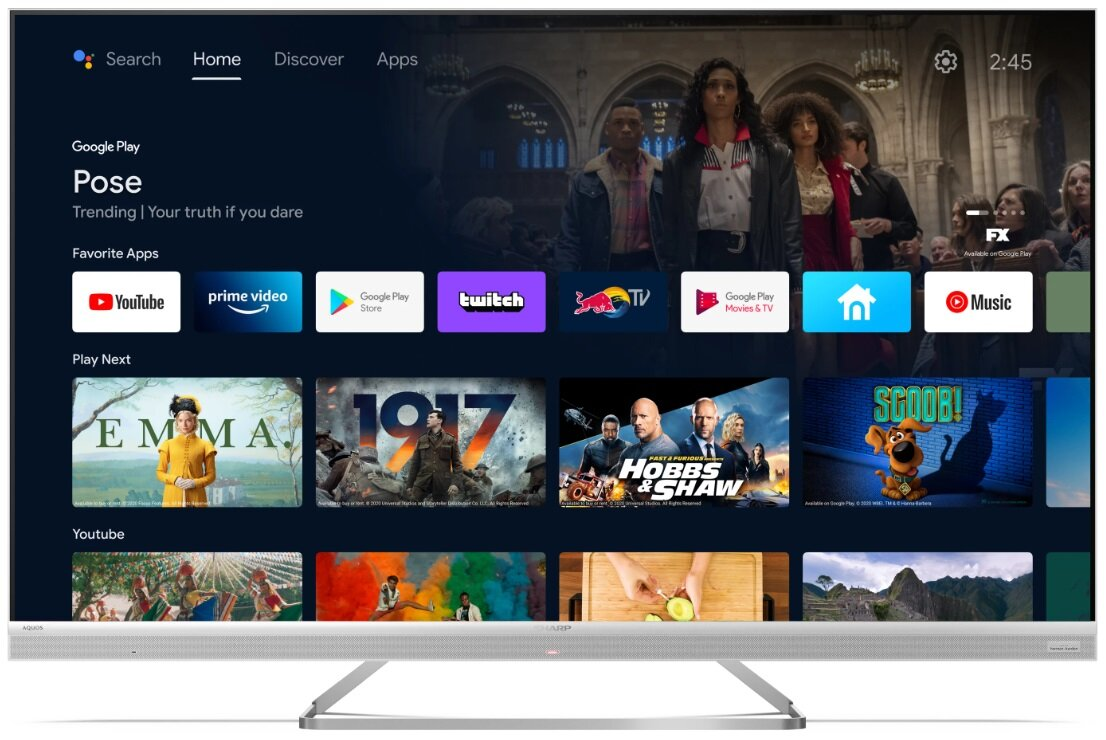 Ekran Smart TV pokazujący ekran główny z aplikacjami takimi jak YouTube, Prime Video.