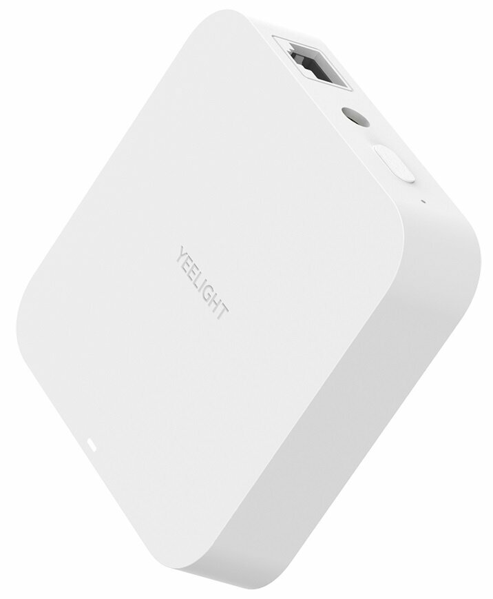 Białe urządzenie Yeelight Smart Home, pod kątem, z portem Ethernet.