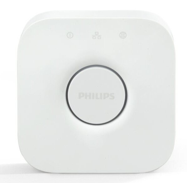 Biały kwadratowy mostek Philips Hue z centralnym przyciskiem i lampkami kontrolnymi.