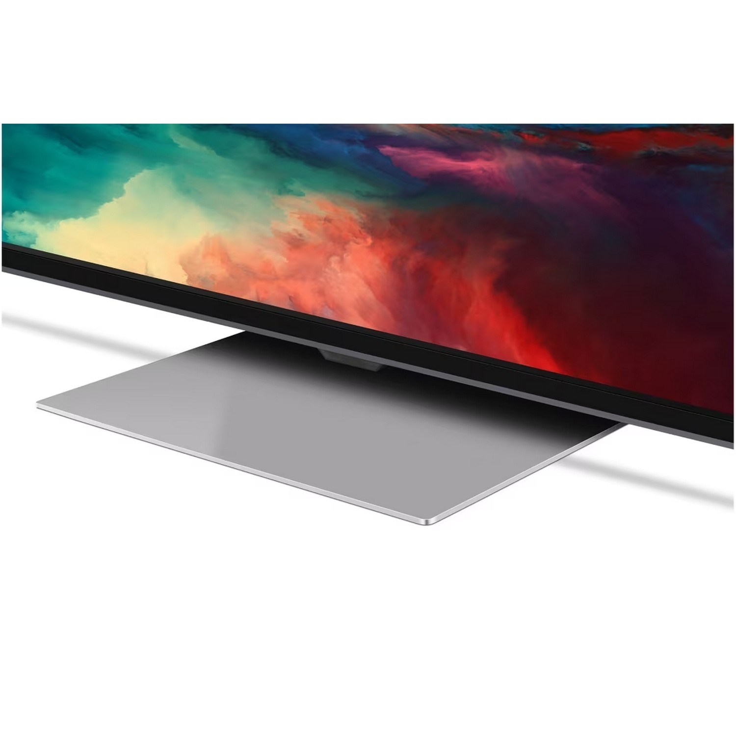 Un écran de télévision avec un design abstrait coloré, monté sur un support argenté.
