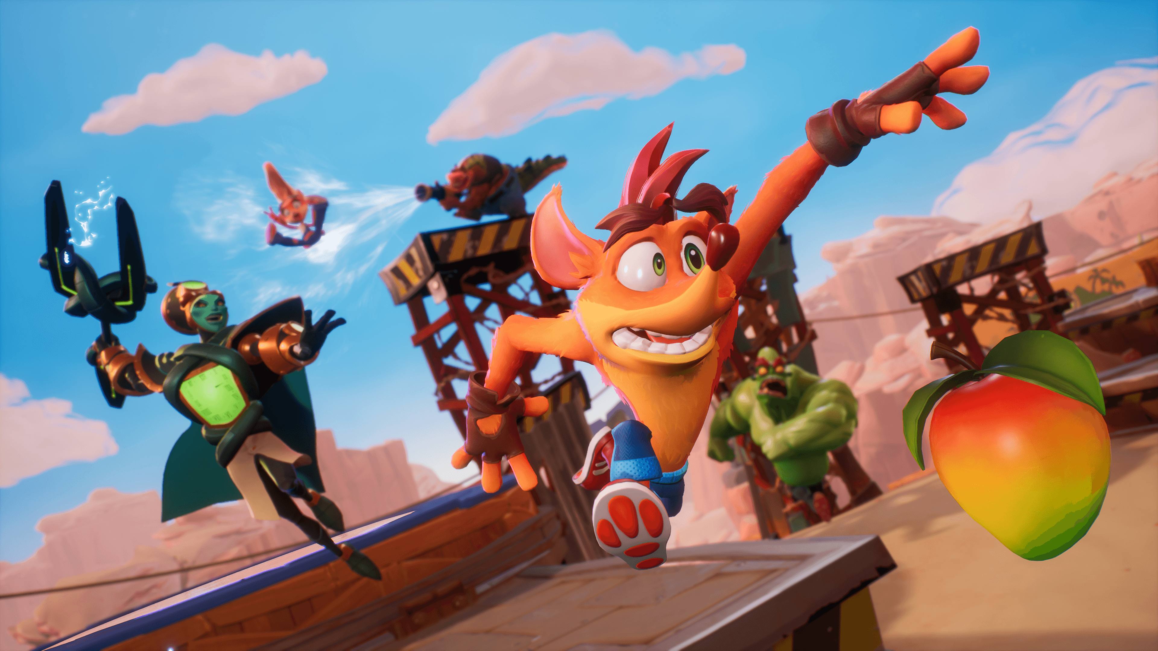 Crash Bandicoot saute dans un désert coloré, avec d'autres personnages et une mangue.