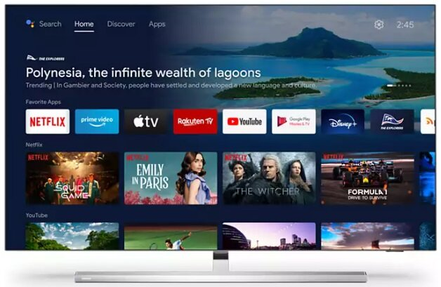 Ekran TV wyświetlający menu domowe z aplikacjami, jak Netflix, Prime Video.