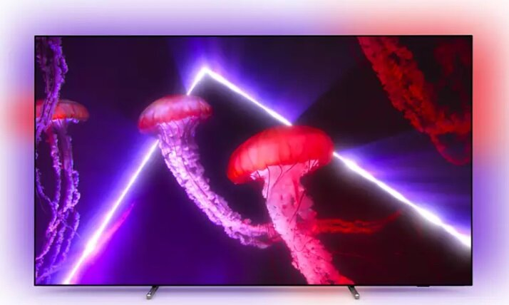 Ekran telewizora wyświetla meduzy z neonowymi światłami i ciemnym tłem.