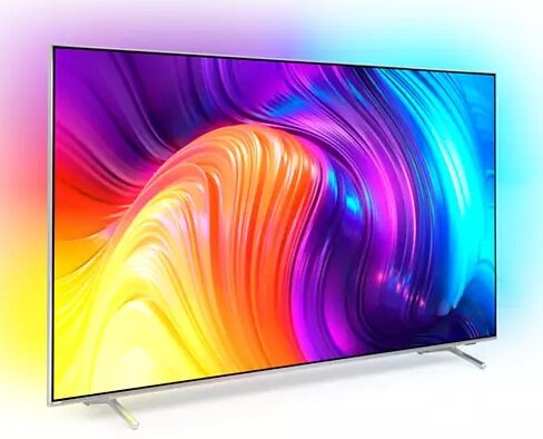 Nowoczesny telewizor ze srebrną podstawą wyświetla kolorowy obraz abstrakcyjny z fioletowymi, żółtymi i niebieskimi odcieniami.